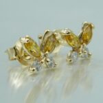 Schmetterlinge Ohrstecker aus 585 Gold mit gelben Zirkonias in Marquiseschliff und Brillantenschliff