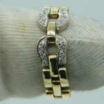 Ein eleganter Hufeisen Goldring in Bicolor mit echten Diamanten