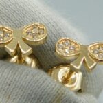 Schleife Ohrstecker aus 585 Gold mit gefassten Zirkonien