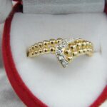 Kugelgoldring aus 750er Gold mit 5 Diamanten